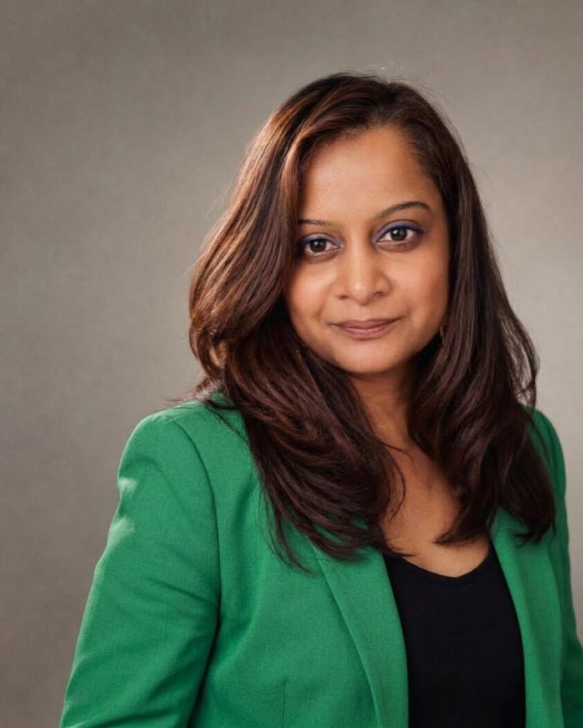Pavitra ST in an emerald blazer
